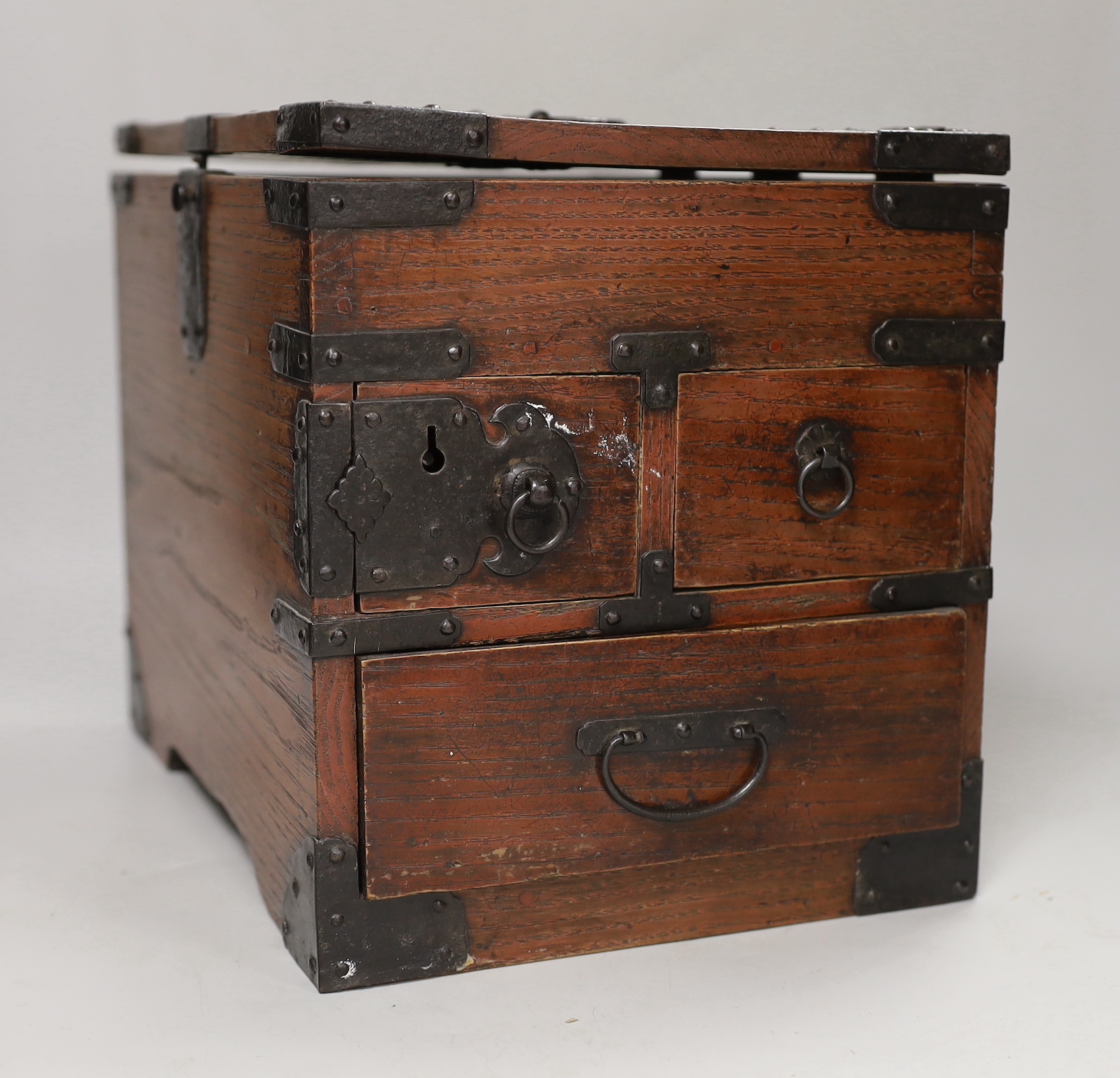 A Japanese iron mounted box, with black lacquer interior tray, box 30cm wide